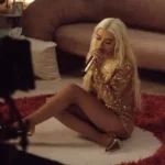 Christina Aguilera Channeled a Gold Disco Ball “Re-Imagining” Her Greatest Hits