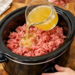 Pour chicken broth over ground beef, plus 3 ingredients, into slow cooker for a creamy meal that’s the one everyone asks for