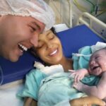 Adorable: Newborn baby smiles at Dad when she recognizes his voice