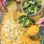 Pour canned cheddar broccoli soup and these 2 ingredients over uncooked egg noodles into a 9×13 baking dish for a comforting meal people always return